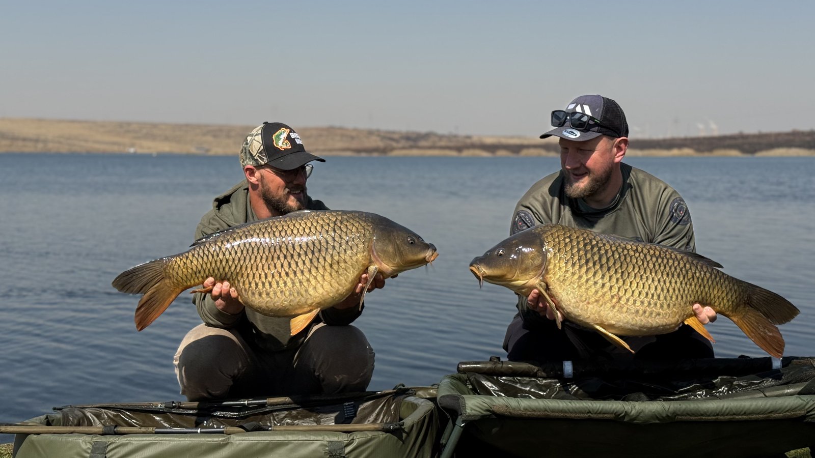 Both anglers holding their best carp of the session