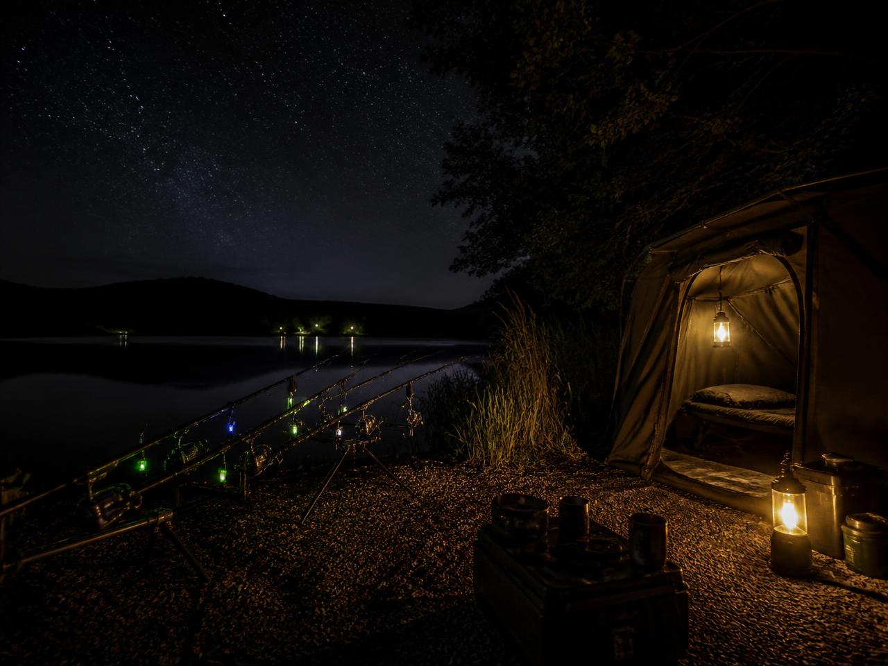 Bivvy camp at night with illuminated alarms